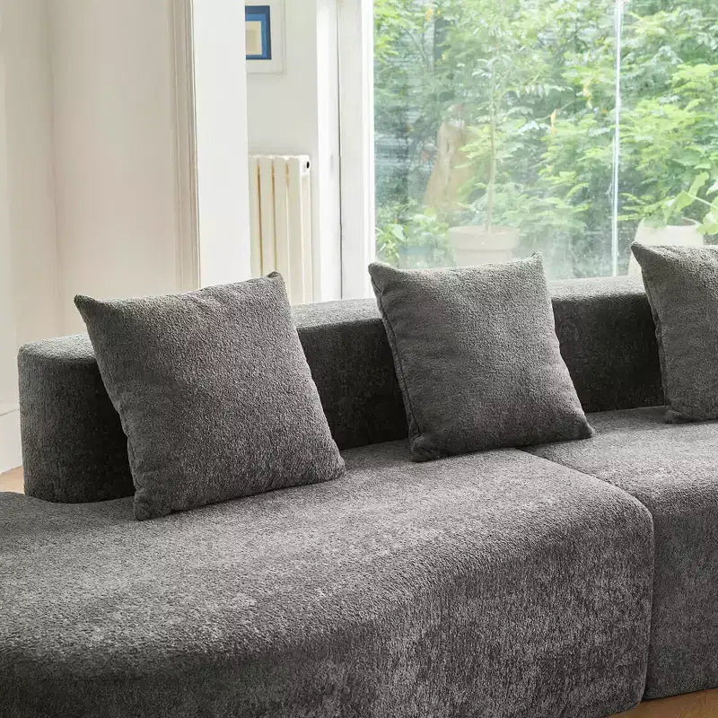 Divano modulare componibile a 5 posti curvo in velluto MAYEERTY con cuscini decorativi