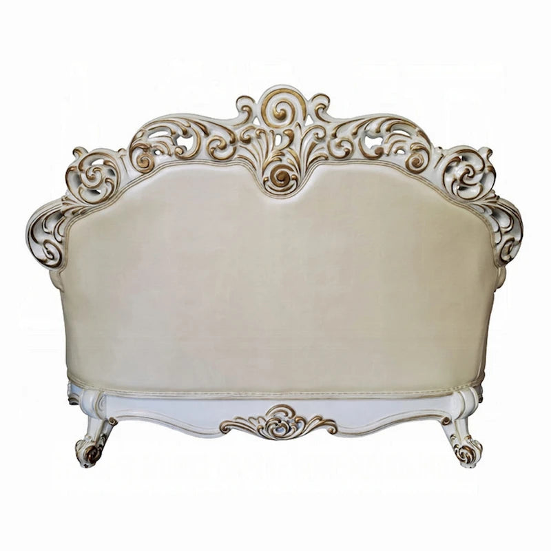 Traditional Carved Loveseat in Champagne Faux Leather with Nailhead Trim, 70 Inch