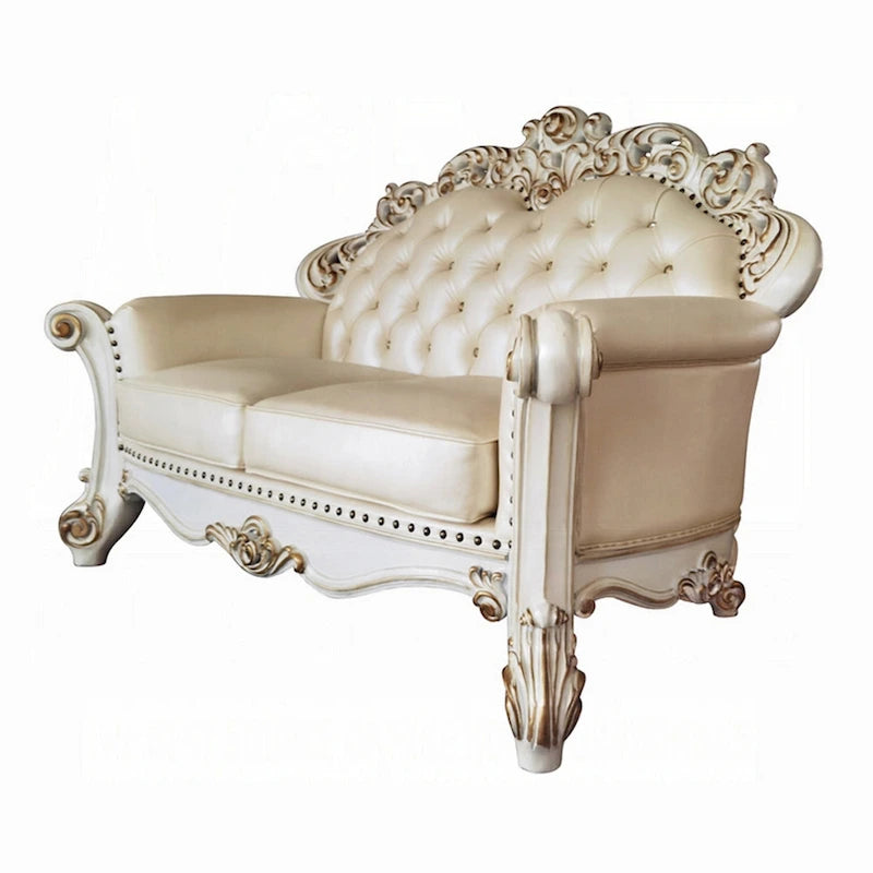 Traditional Carved Loveseat in Champagne Faux Leather with Nailhead Trim, 70 Inch