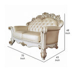 Traditional Carved Loveseat in Champagne Faux Leather with Nailhead Trim, 70 Inch
